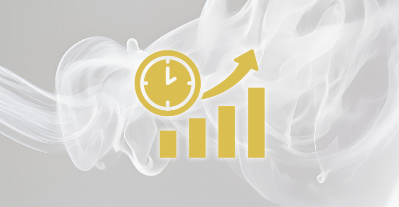 An image showing an icon of a clock with increasing bar chart levels in front of a white smokey background.